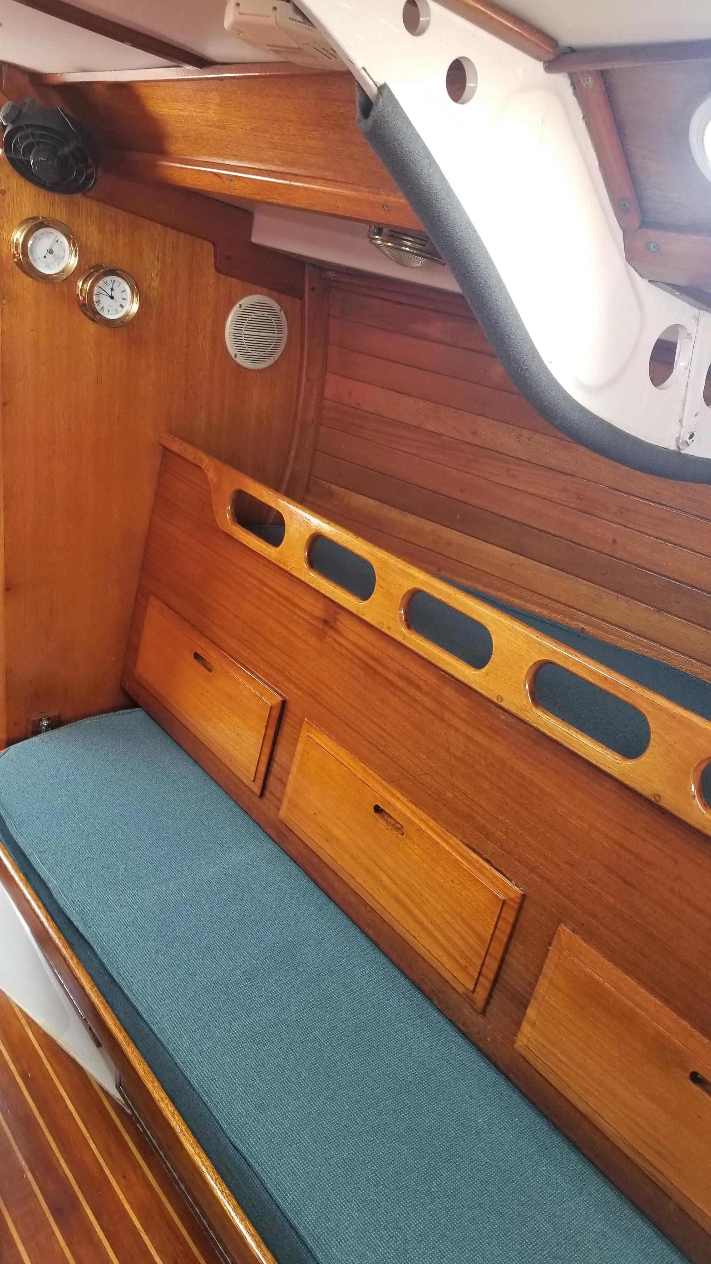 Main saloon port settee and cabin sole with teak trim