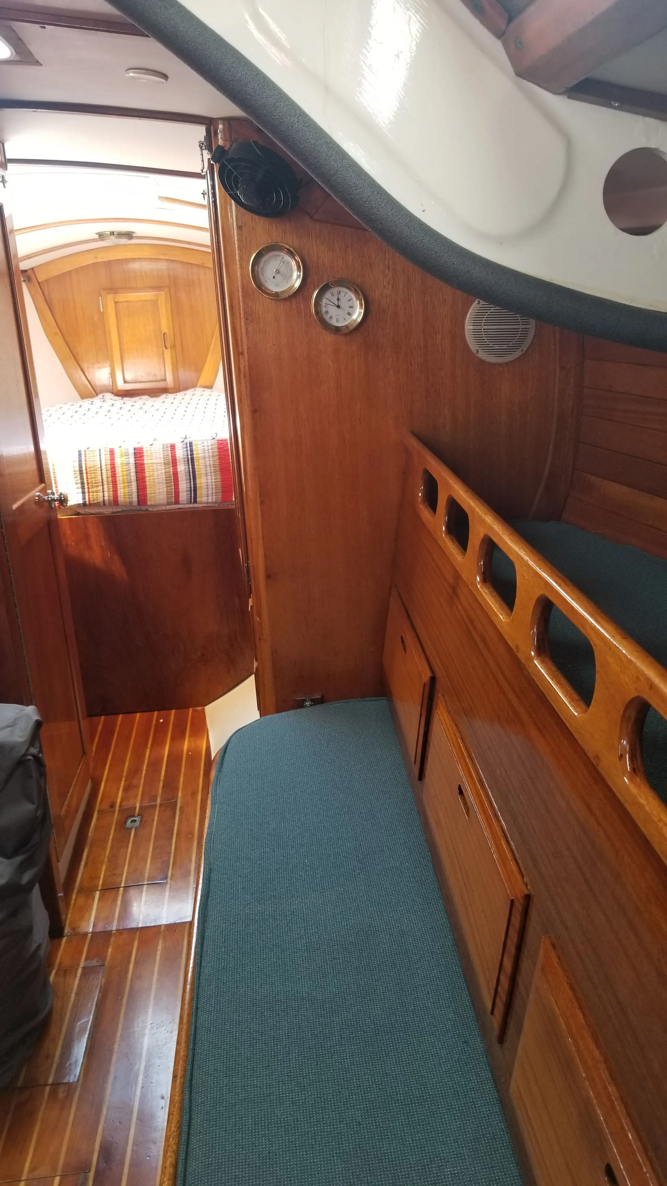 Settee berths with storage lockers alongside in the saloon