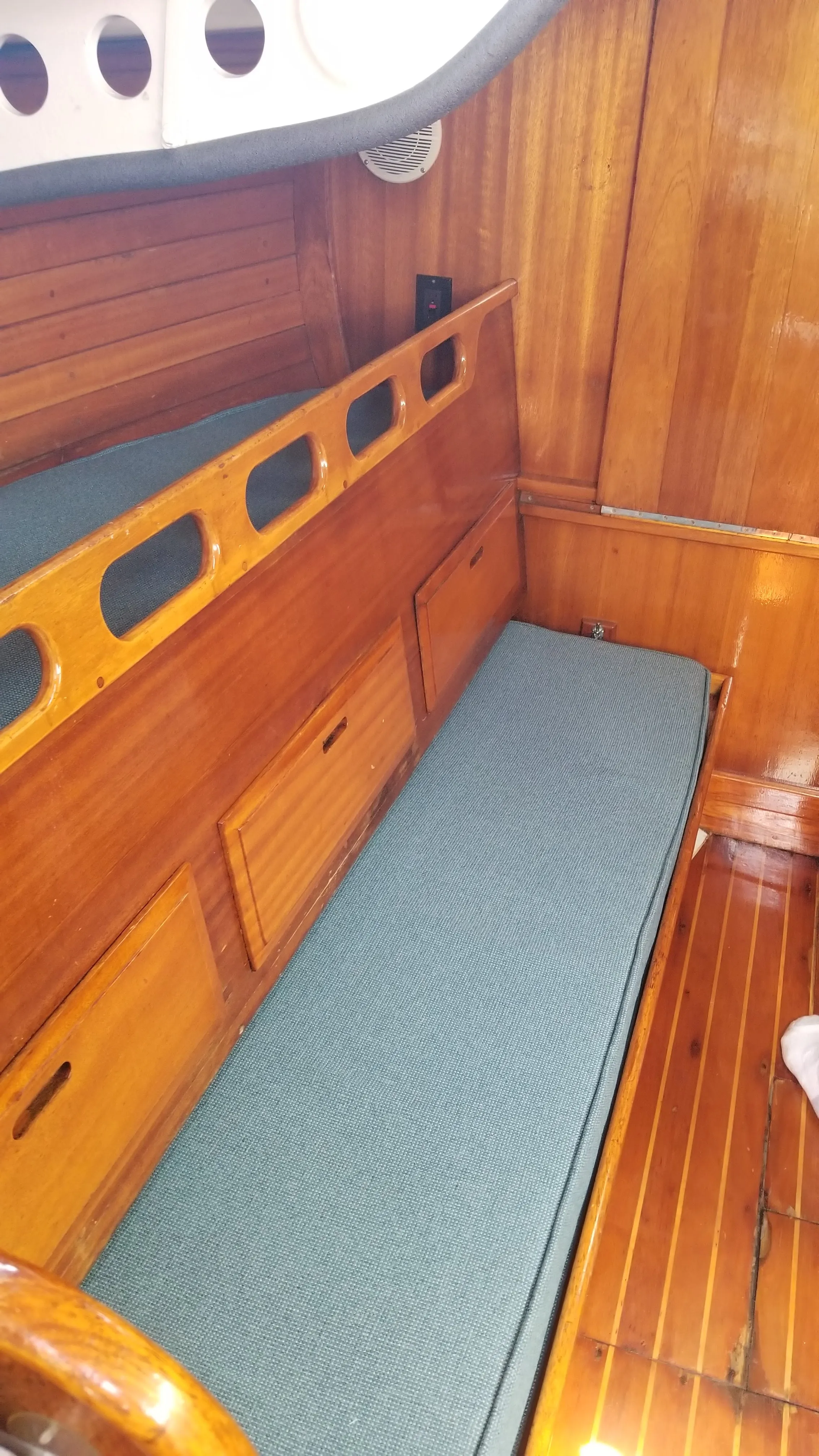 Bilge area with hoses, pumps, and maintenance access
