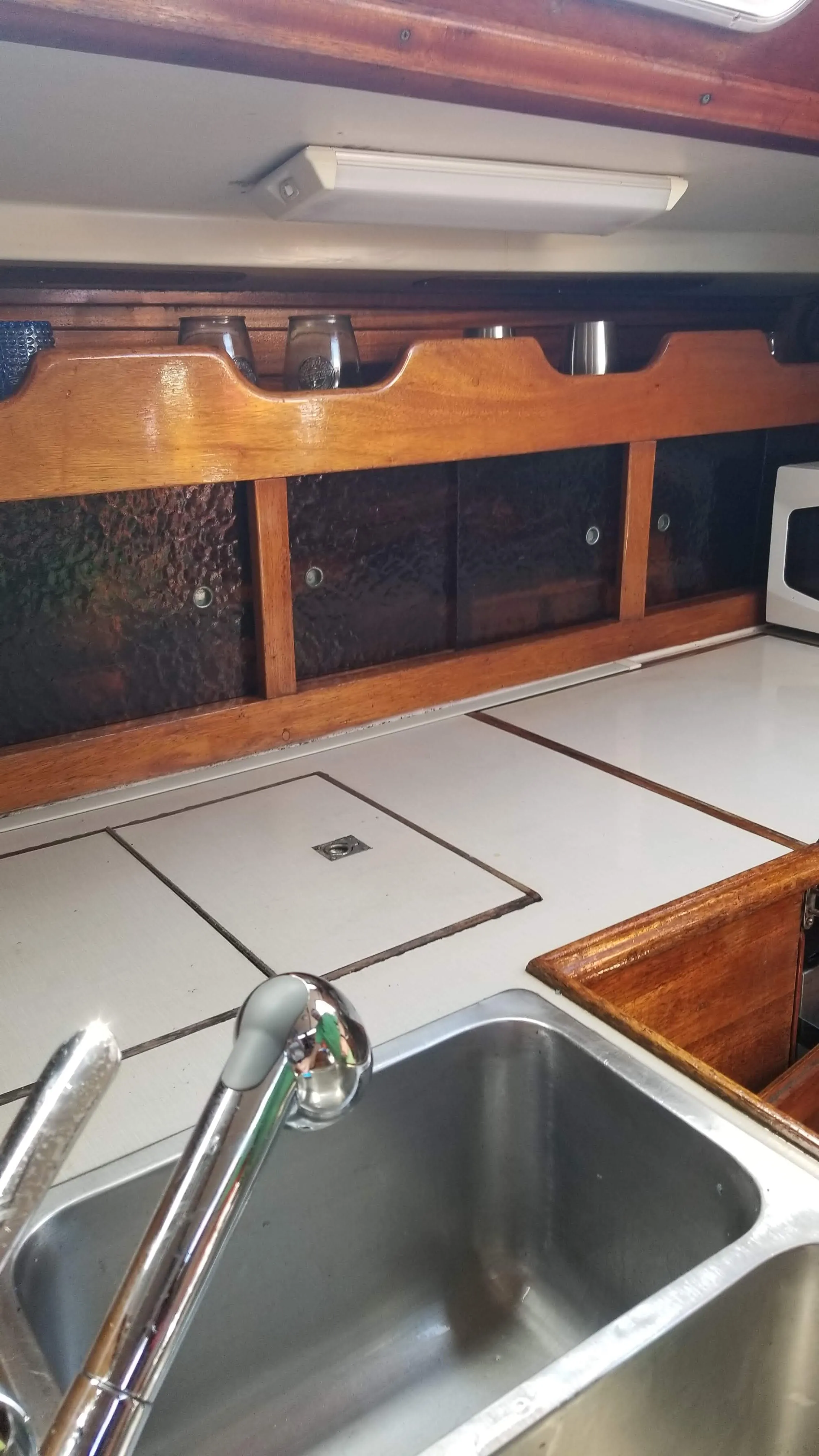 Galley sink, faucet, and nearby dry storage