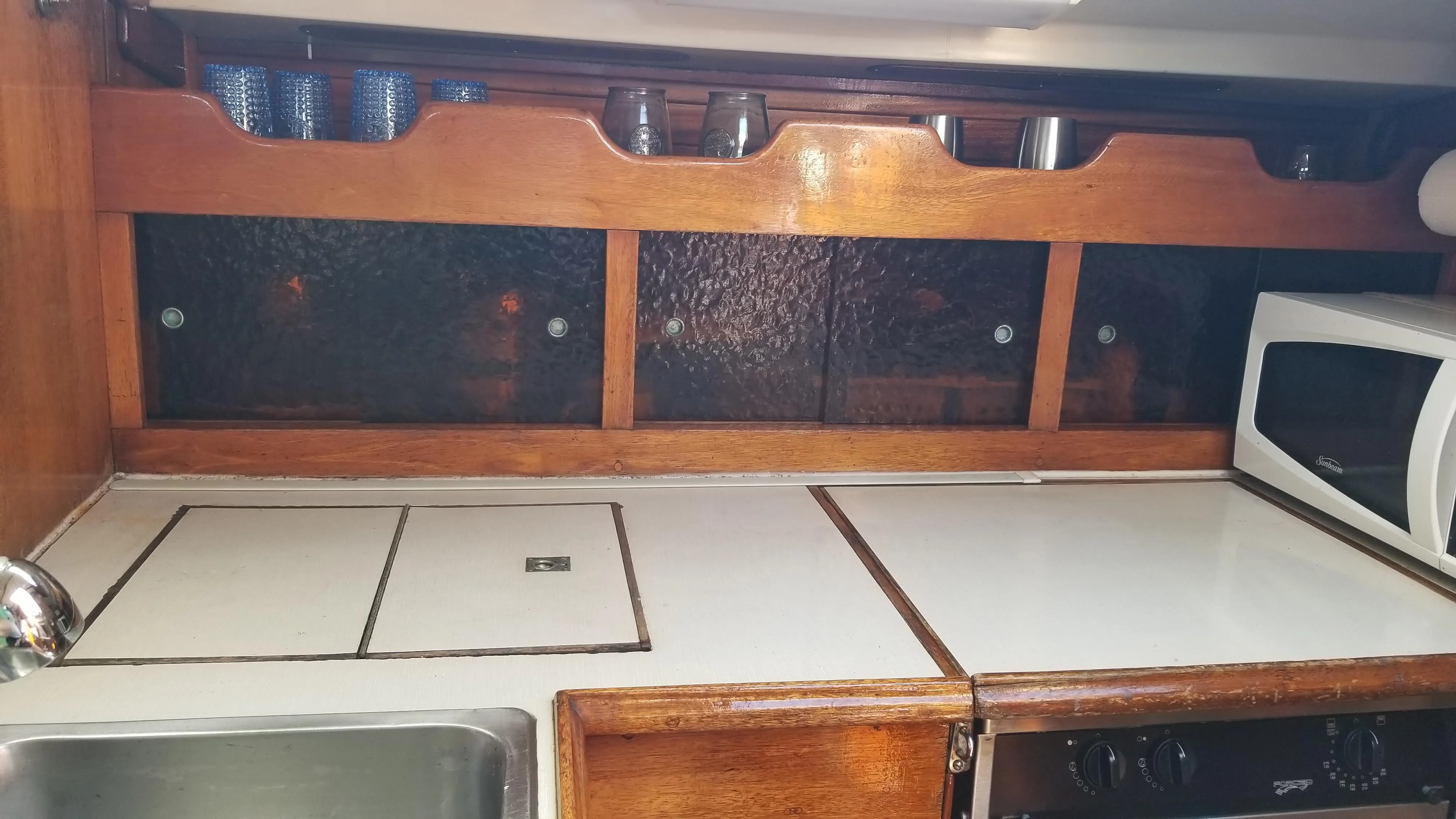 Galley appliances and countertop layout along the hull