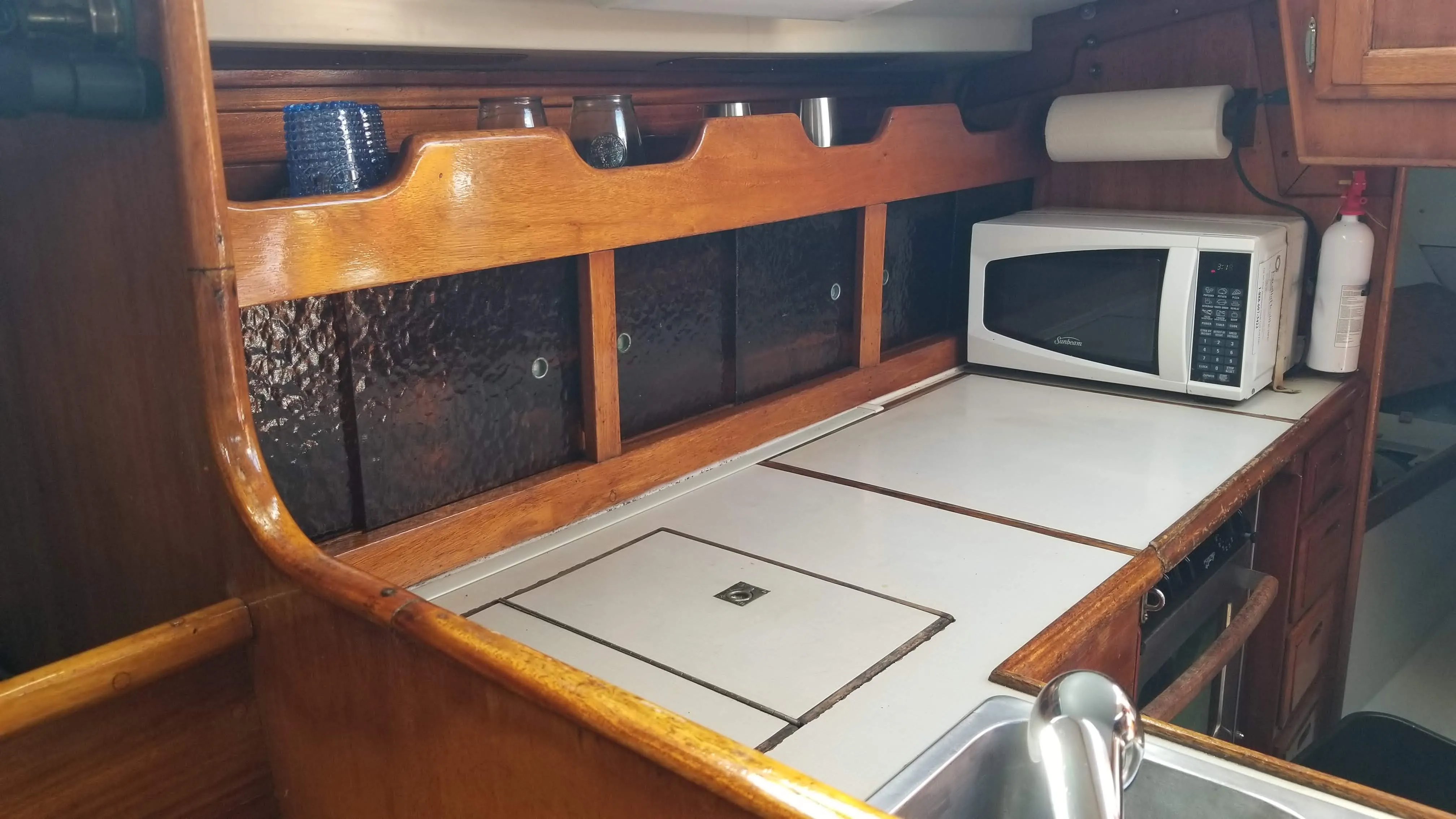 Cooking area with stove cover and backsplash