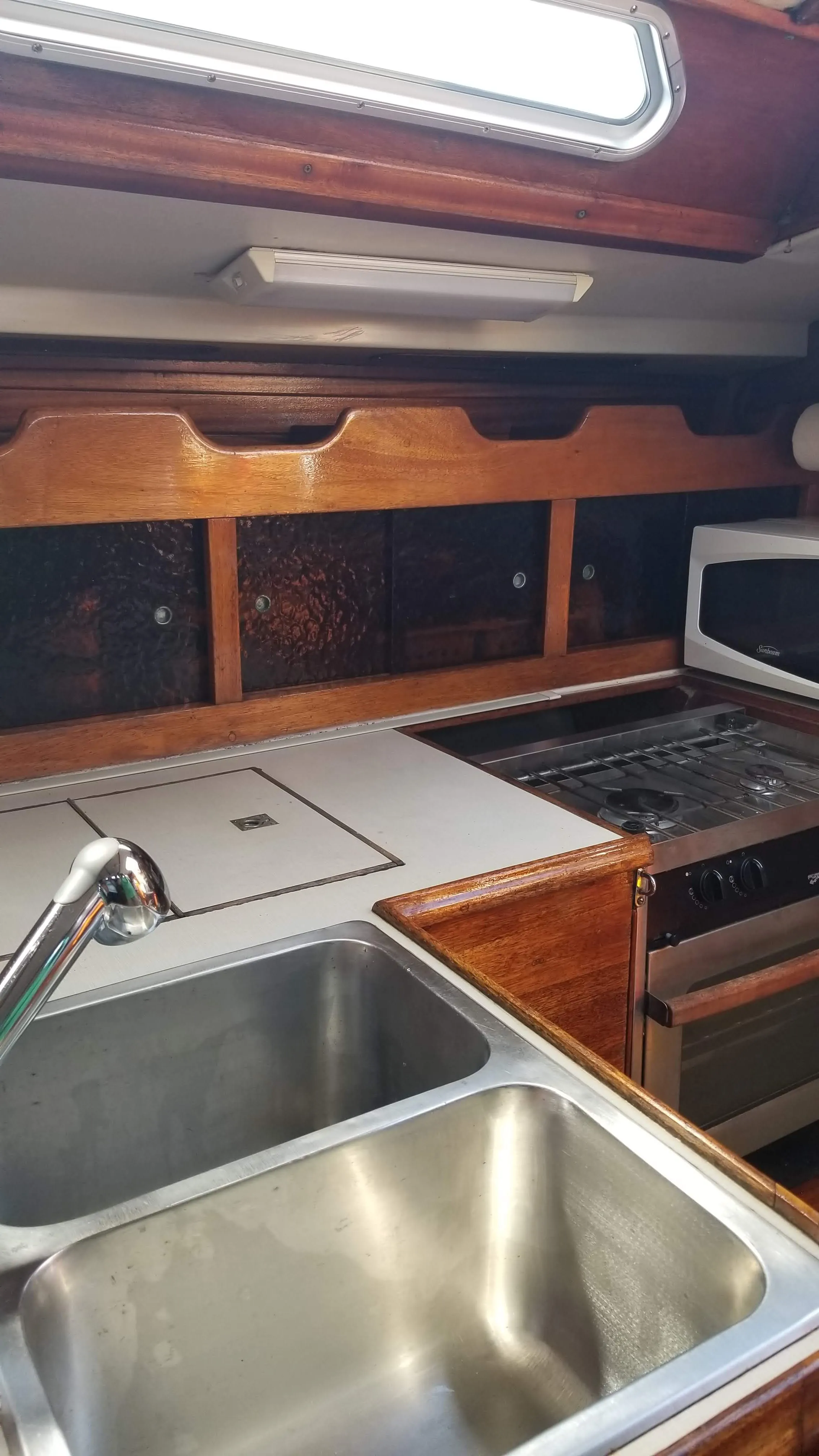 Outboard galley run with counter and fiddles