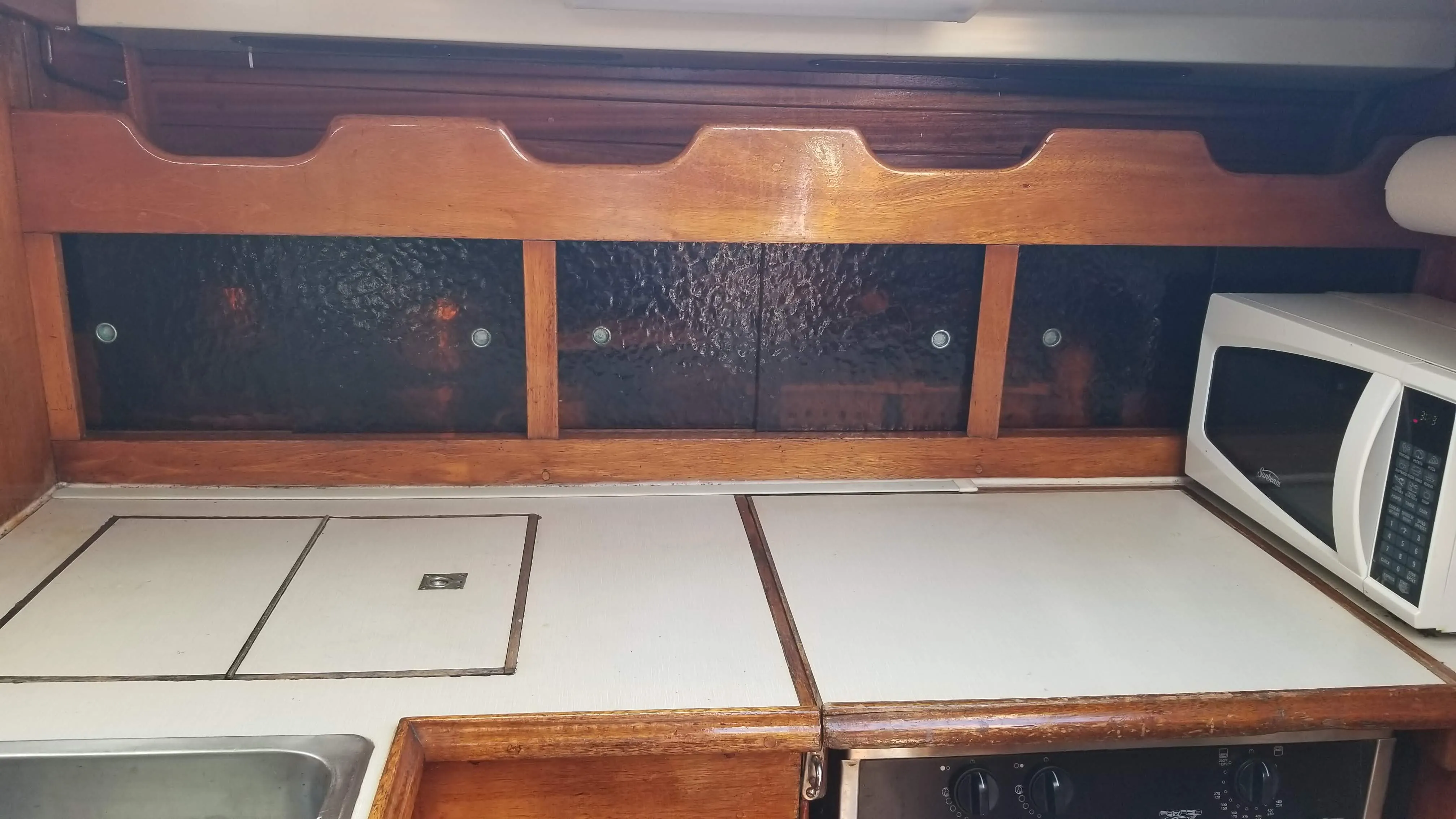 Stove and gimbal hardware in the galley