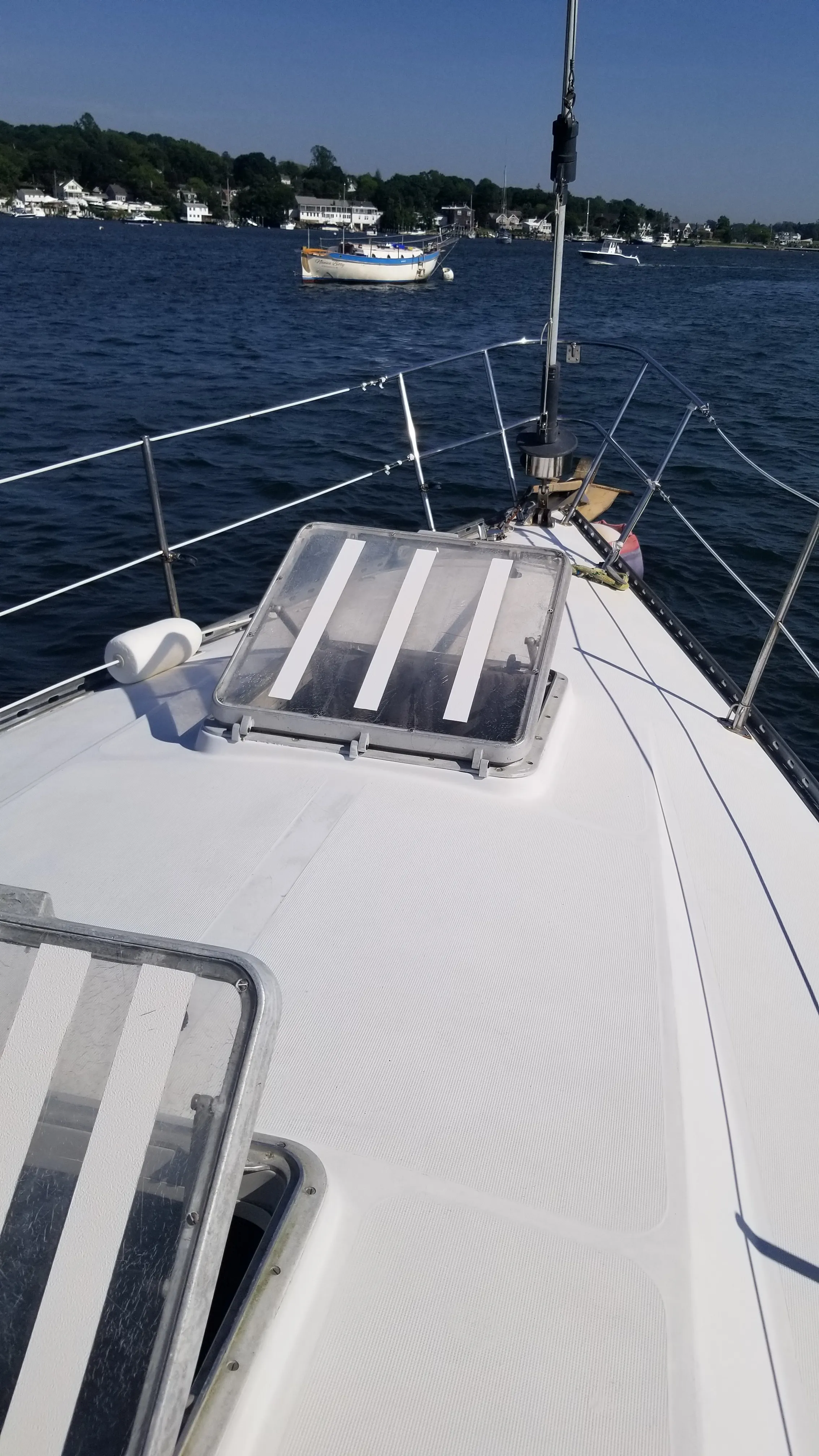 Stanchions, lifelines, and deck looking aft along the starboard side
